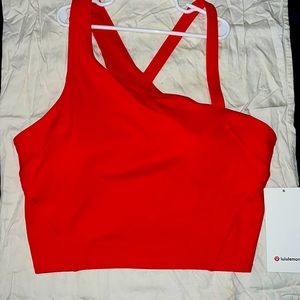 Brand new Lululemon. Cropped/Asymmetrical Tank. Different sizes available.